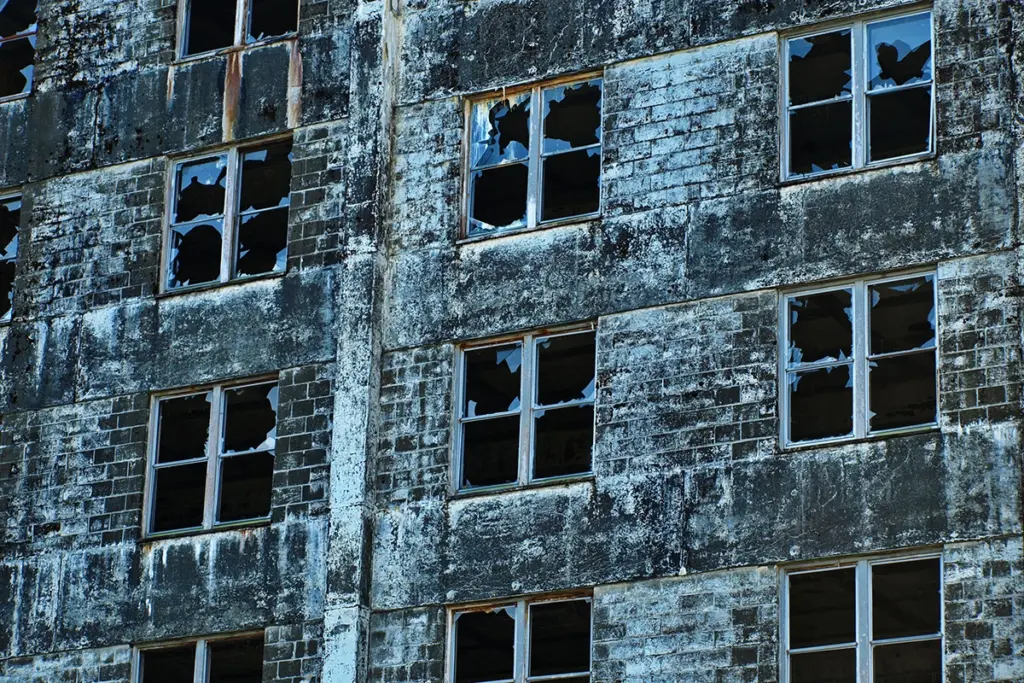 industrial brick building with broken windows